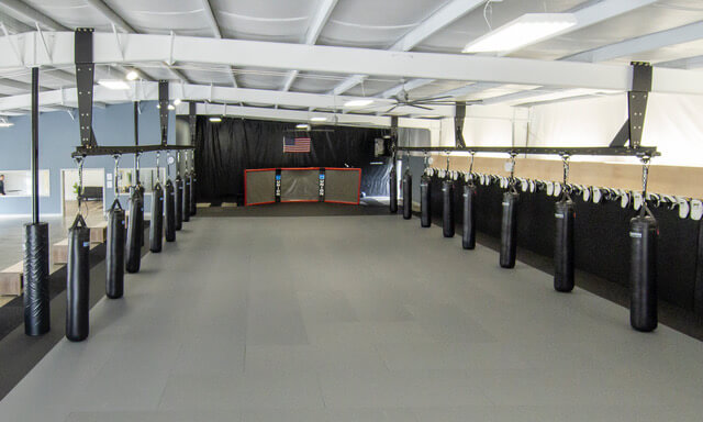 boxing gym with a line of heavy punching bags