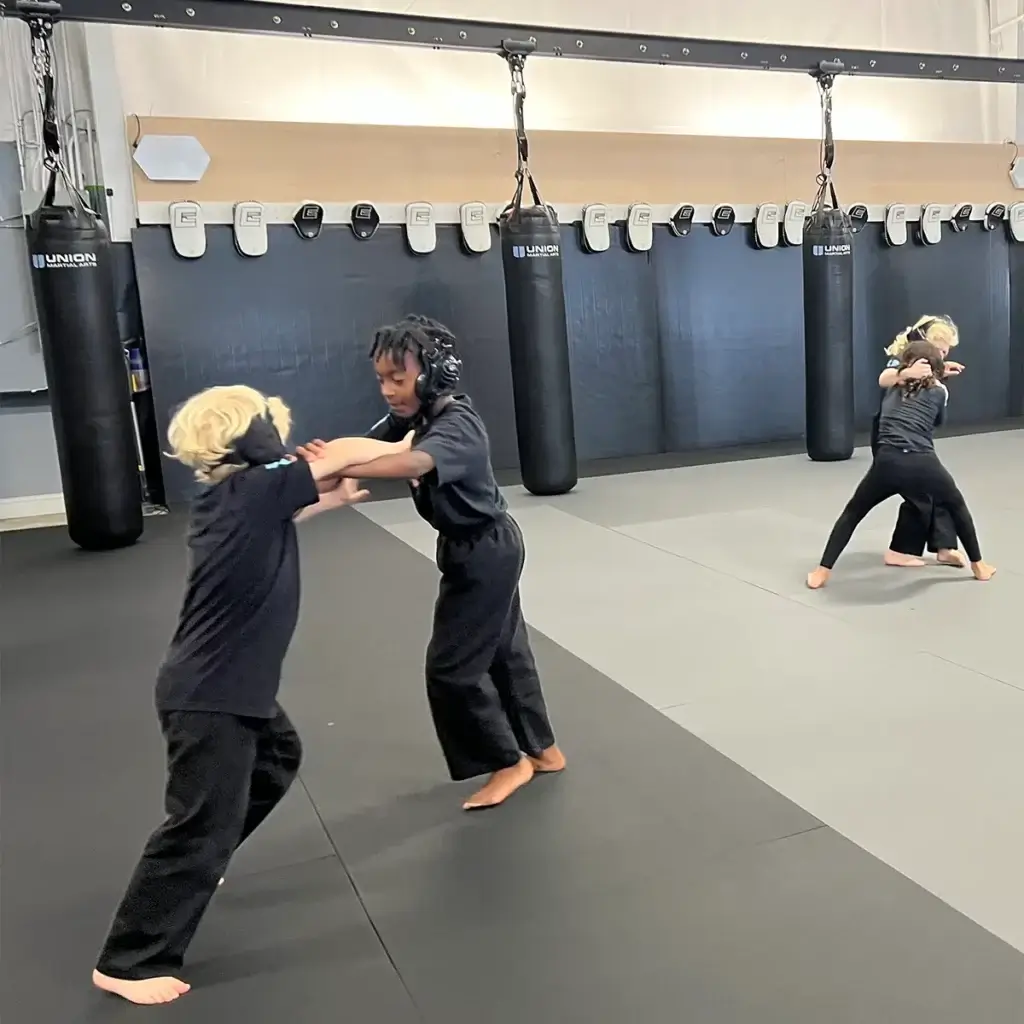 Kids in Jiu Jitsu training